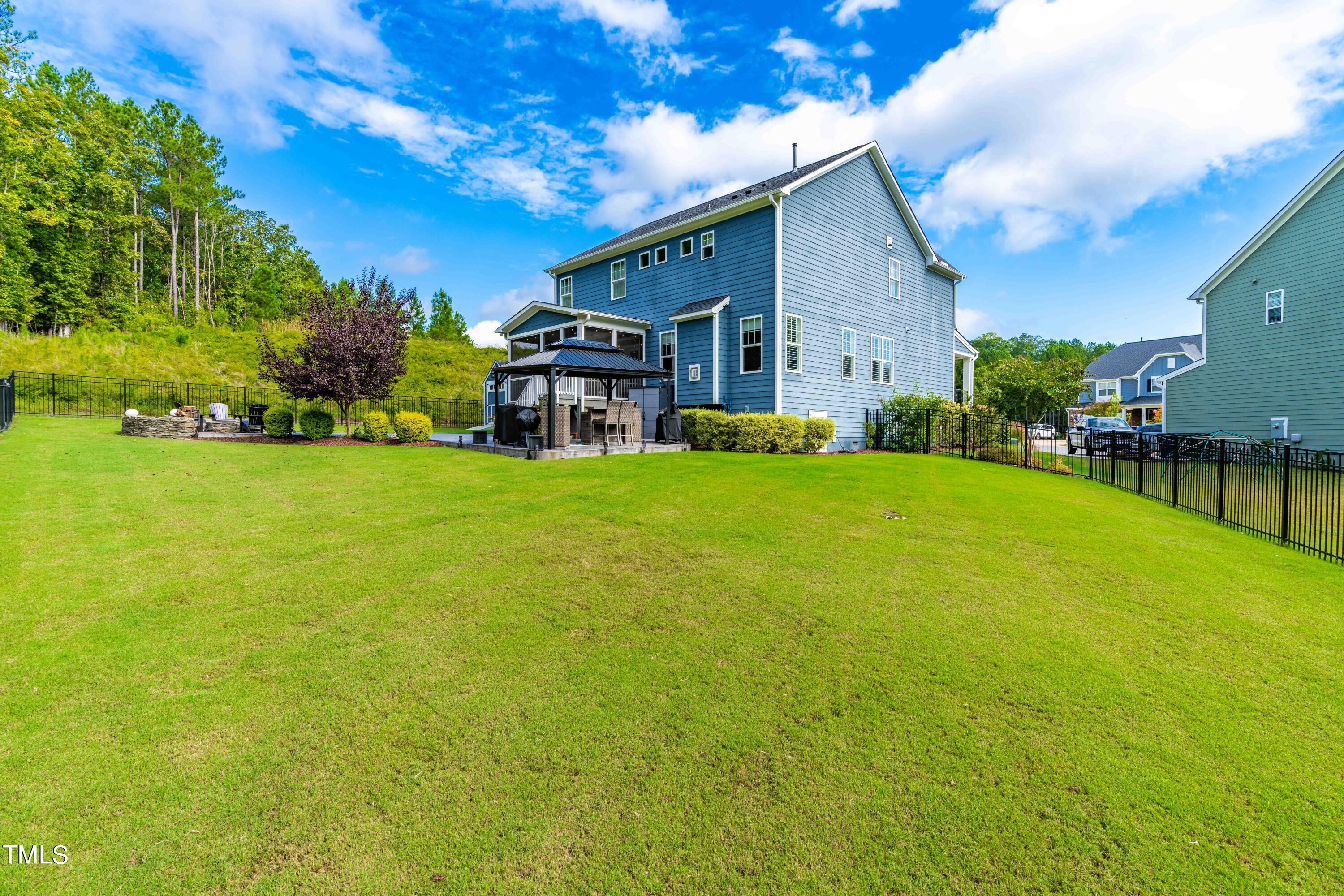 190 Hidden Bluff Drive Pittsboro, NC 27312 - Photo 54 of 58 a view of a house with a big yard plants and large trees