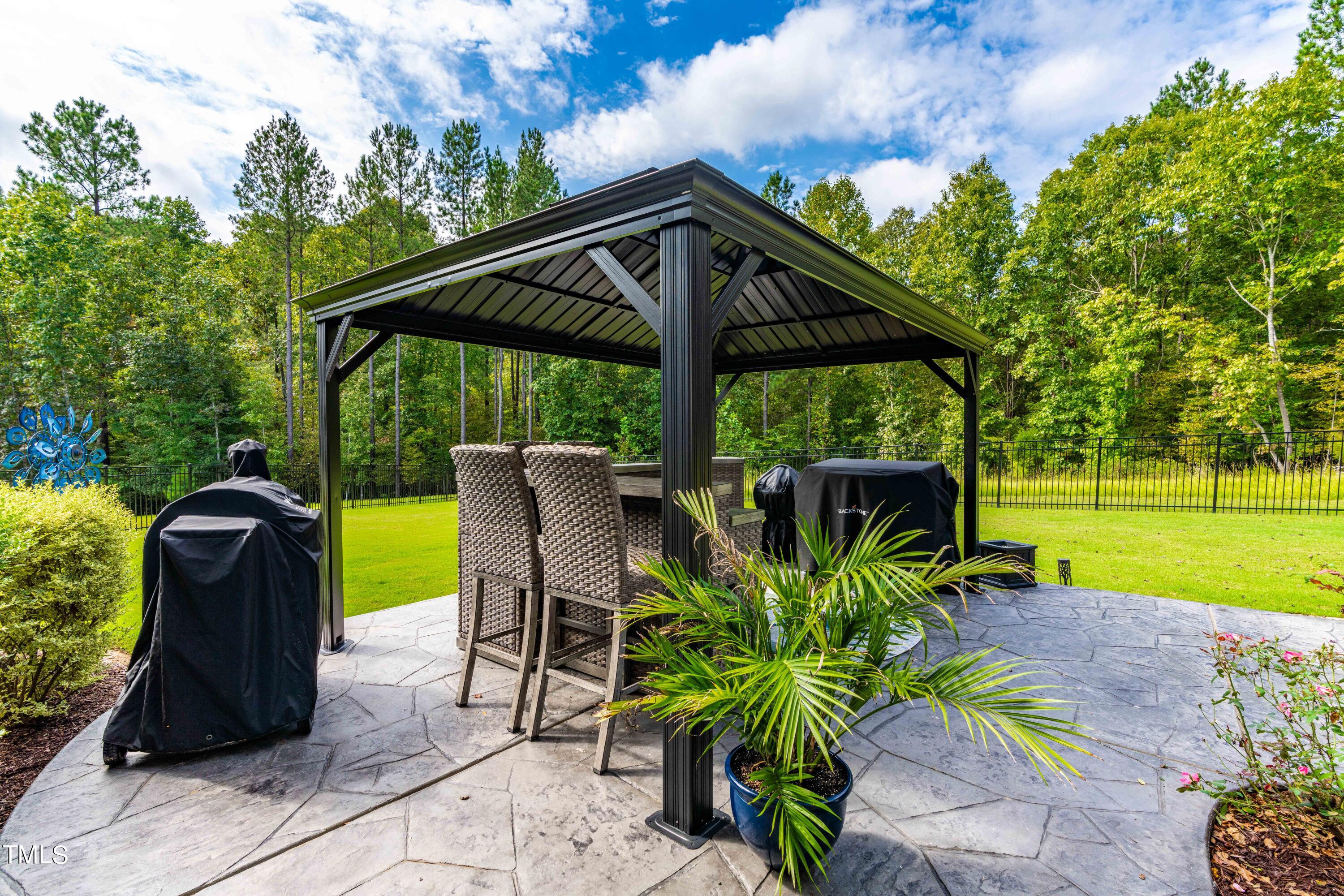 190 Hidden Bluff Drive Pittsboro, NC 27312 - Photo 56 of 58 a view of a chair and table in the garden