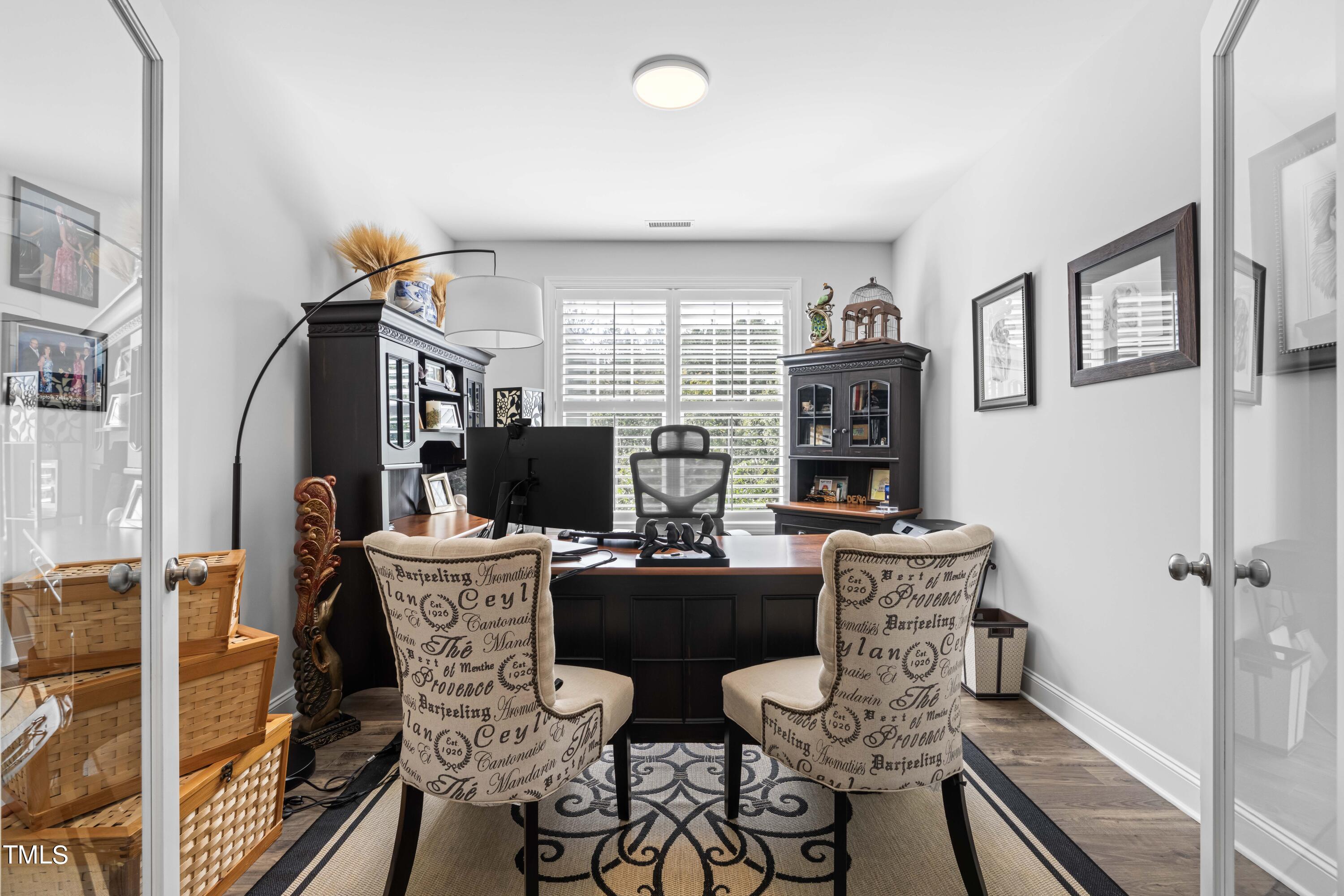 190 Hidden Bluff Drive Pittsboro, NC 27312 - Photo 10 of 58 a dining room with furniture a window and a fireplace