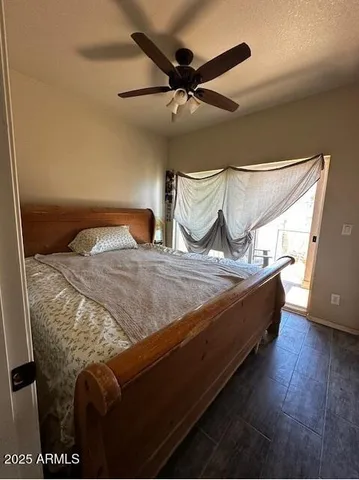 a bed sitting in a bedroom next to a window
