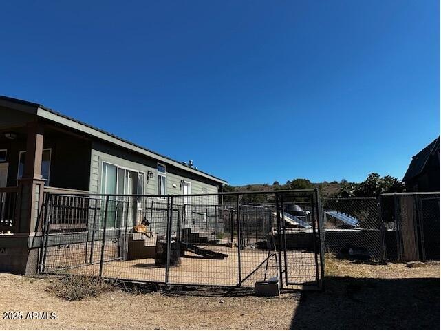 1098 East Horseshoe Springs Road Winkelman, AZ 85192 - Photo 7 of 8 a backyard of a house with table and chairs