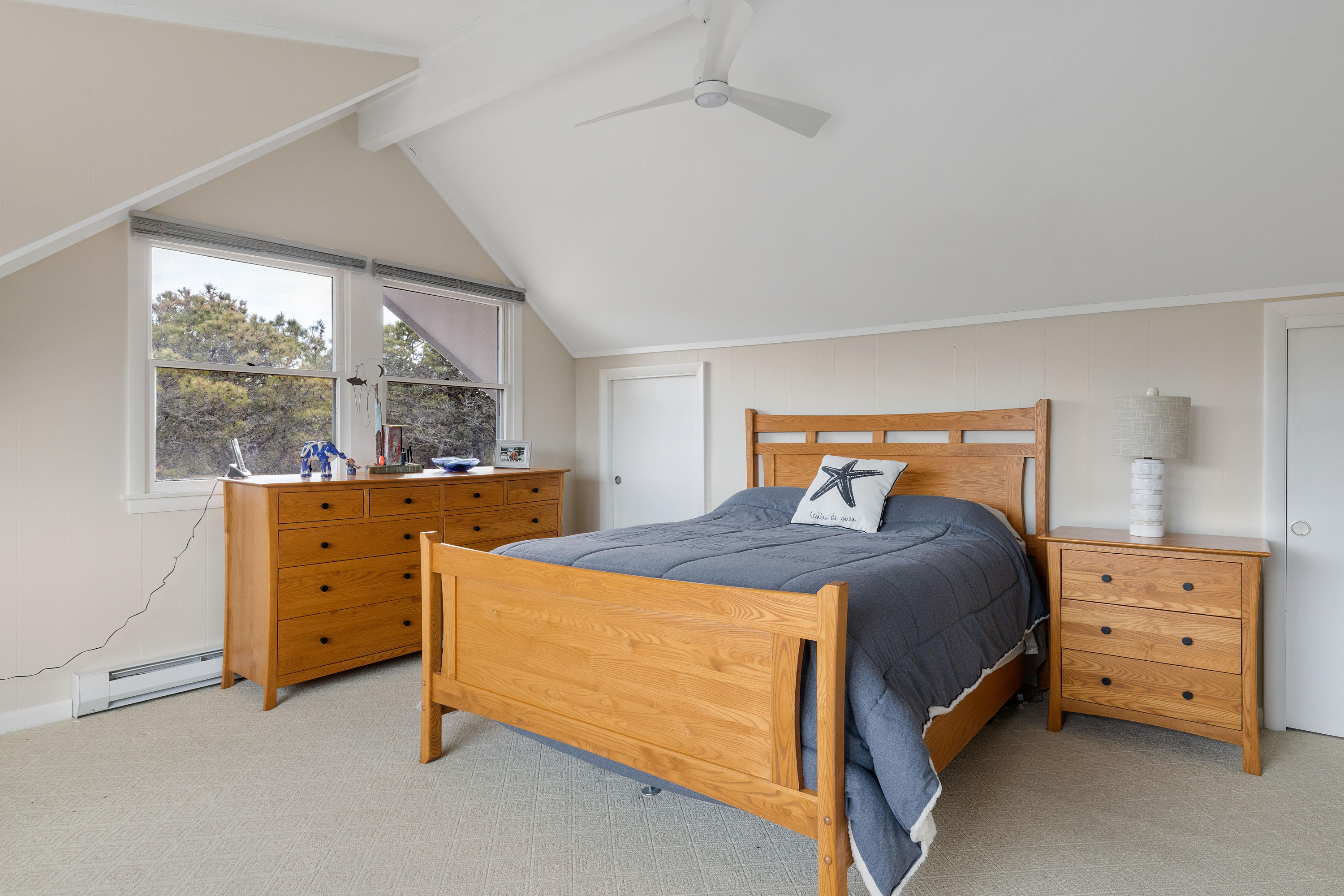 41 Fishermans Road Truro, MA 02666 - Photo 26 of 49 a bedroom with a bed and a dresser