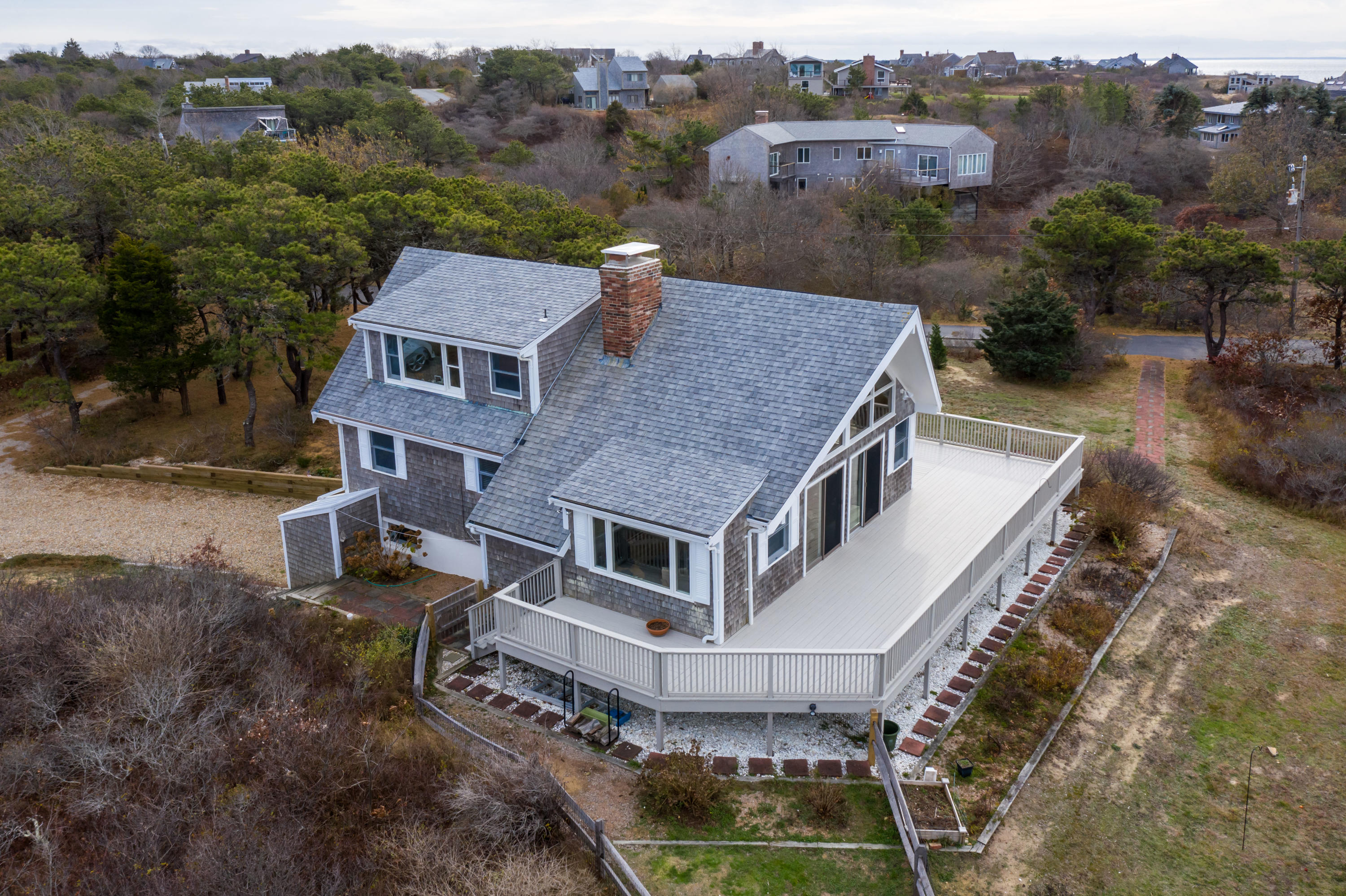 41 Fishermans Road Truro, MA 02666 - Photo 3 of 49 a aerial view of a house with a yard