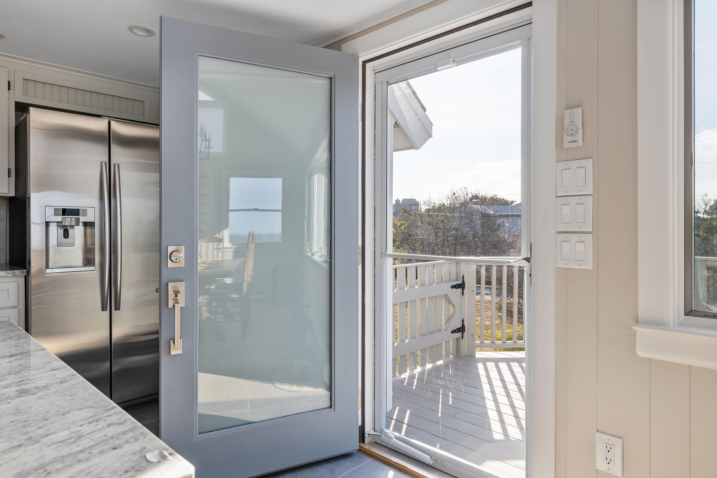 41 Fishermans Road Truro, MA 02666 - Photo 5 of 49 a view of a glass door with a glass door