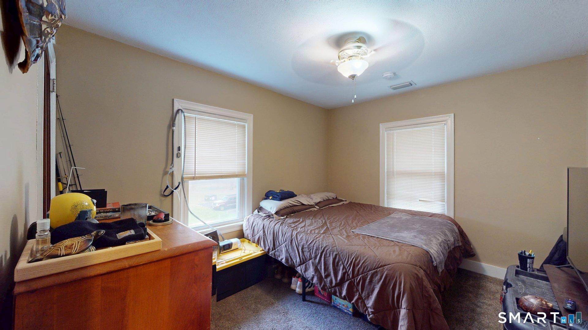 138 Main Street Somers, CT 06071 - Photo 20 of 44 a bedroom with bed and a window