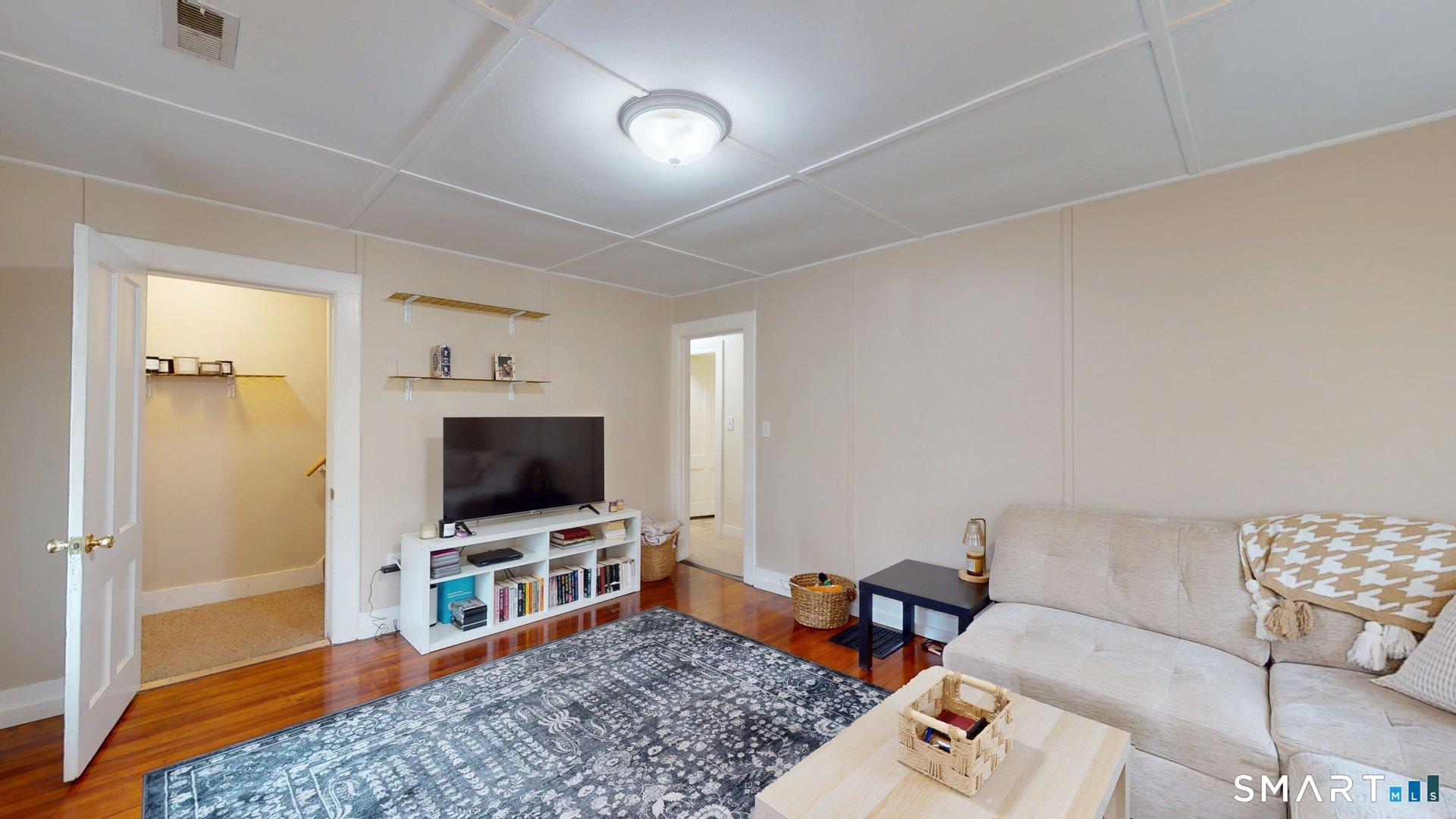 138 Main Street Somers, CT 06071 - Photo 30 of 44 a living room with furniture and a flat screen tv