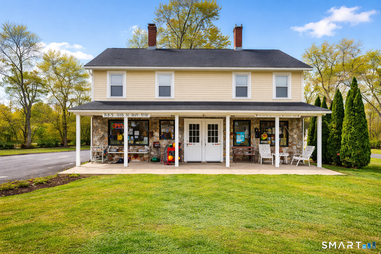 138 Main Street Somers, CT 06071 - Photo 3 of 44 a front view of house with outdoor seating and yard