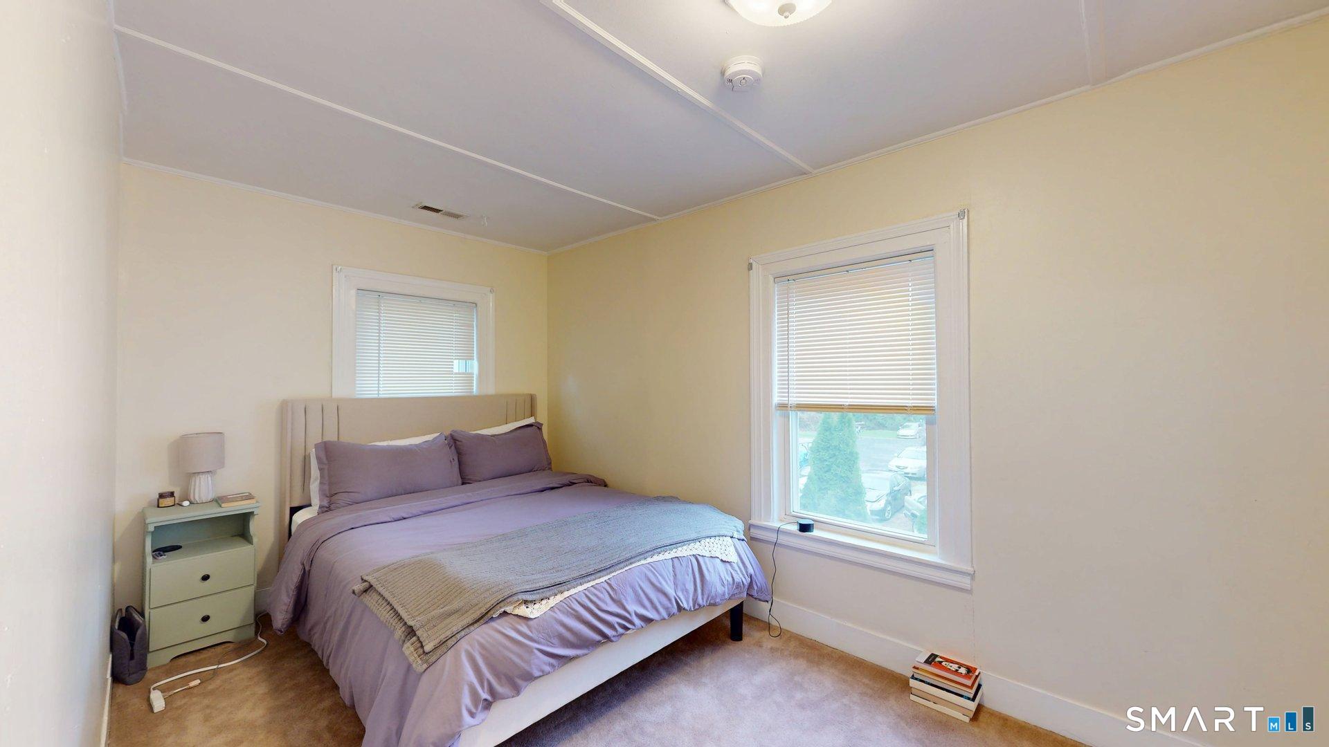 138 Main Street Somers, CT 06071 - Photo 32 of 44 a bedroom with a bed and a window