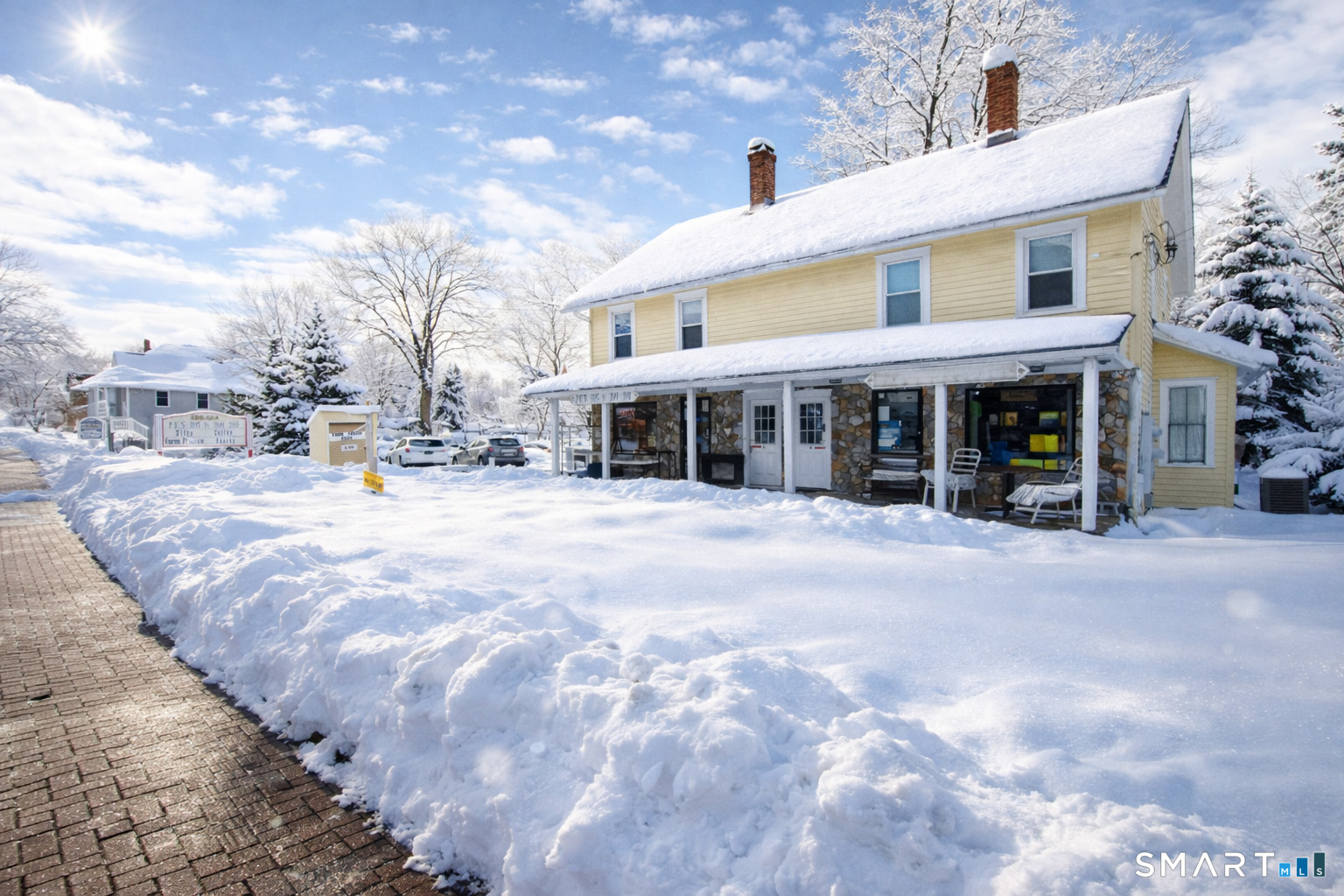 138 Main Street Somers, CT 06071 - Photo 4 of 44 a view of a building with a snow on the road