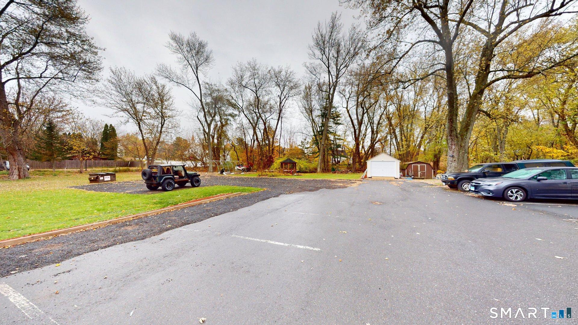 138 Main Street Somers, CT 06071 - Photo 41 of 44 a view of road with parked cars