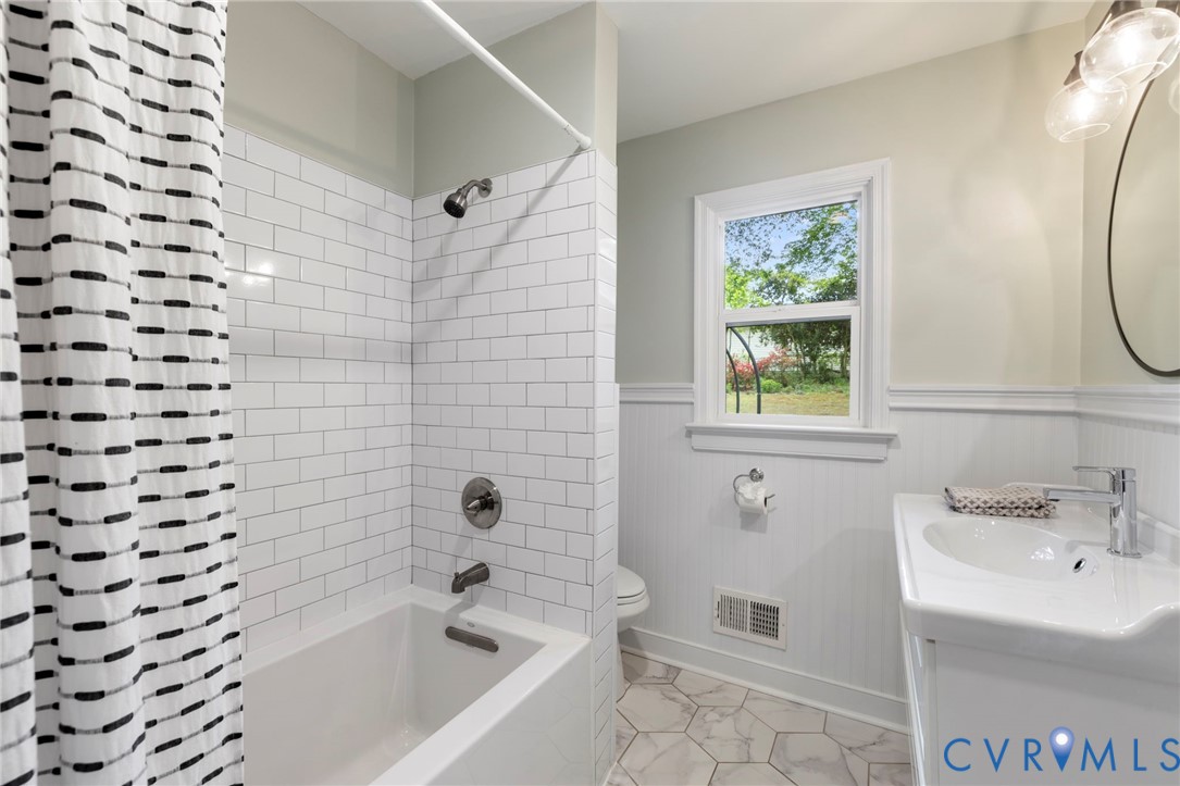 3311 Ottawa Road Richmond, VA 23225 - Photo 14 of 30 a bathroom with a bathtub and a sink