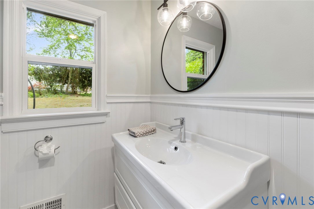 3311 Ottawa Road Richmond, VA 23225 - Photo 15 of 30 a bathroom with a sink and mirror