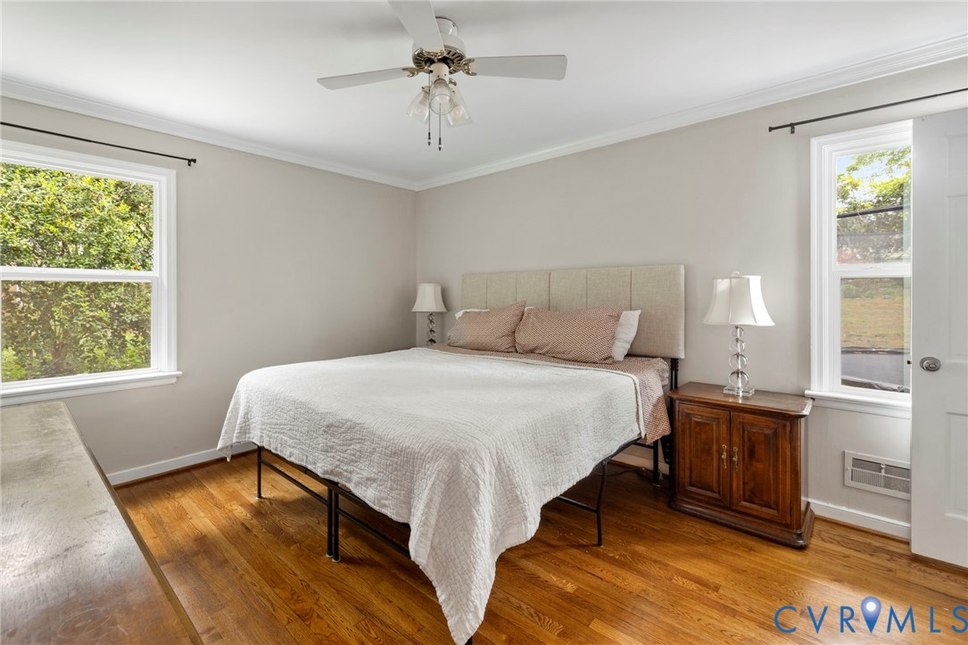 3311 Ottawa Road Richmond, VA 23225 - Photo 18 of 30 a bedroom with a bed and wooden floor
