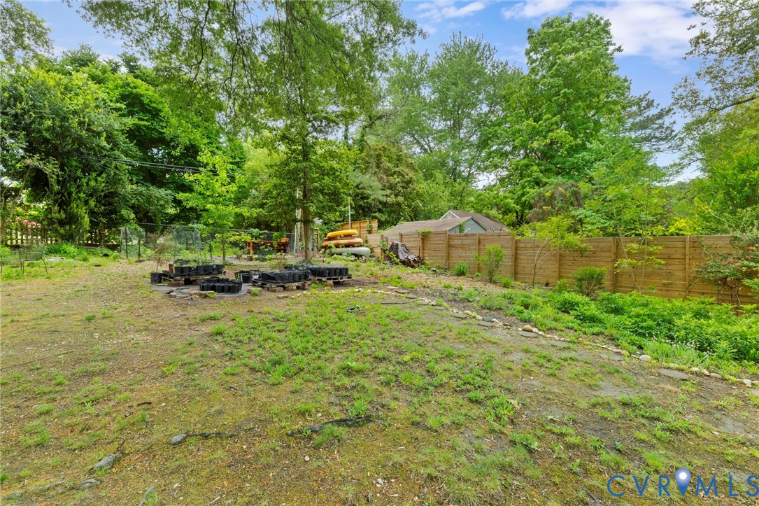 3311 Ottawa Road Richmond, VA 23225 - Photo 25 of 30 a backyard of a house with a yard and outdoor seating
