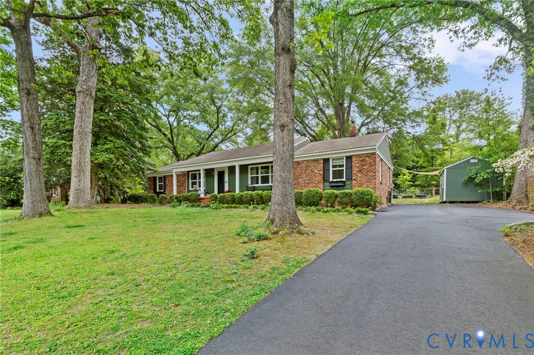3311 Ottawa Road Richmond, VA 23225 - Photo 4 of 30 a front view of a house with a garden