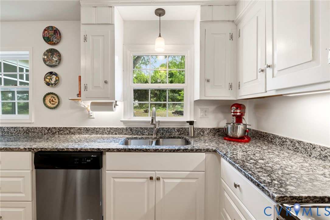 3311 Ottawa Road Richmond, VA 23225 - Photo 10 of 30 a kitchen with granite countertop cabinets and window