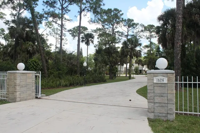 a view of a chair and tables in the yard