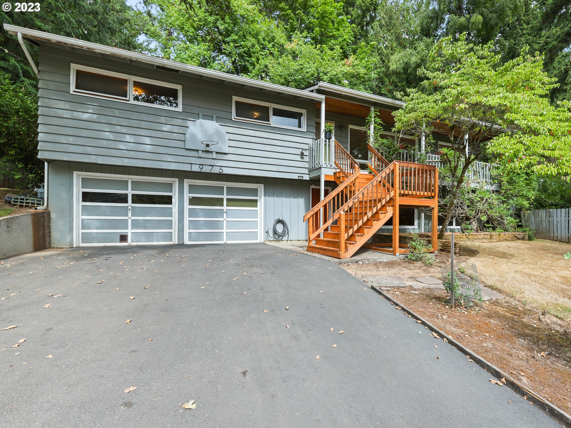 a house view with a backyard space