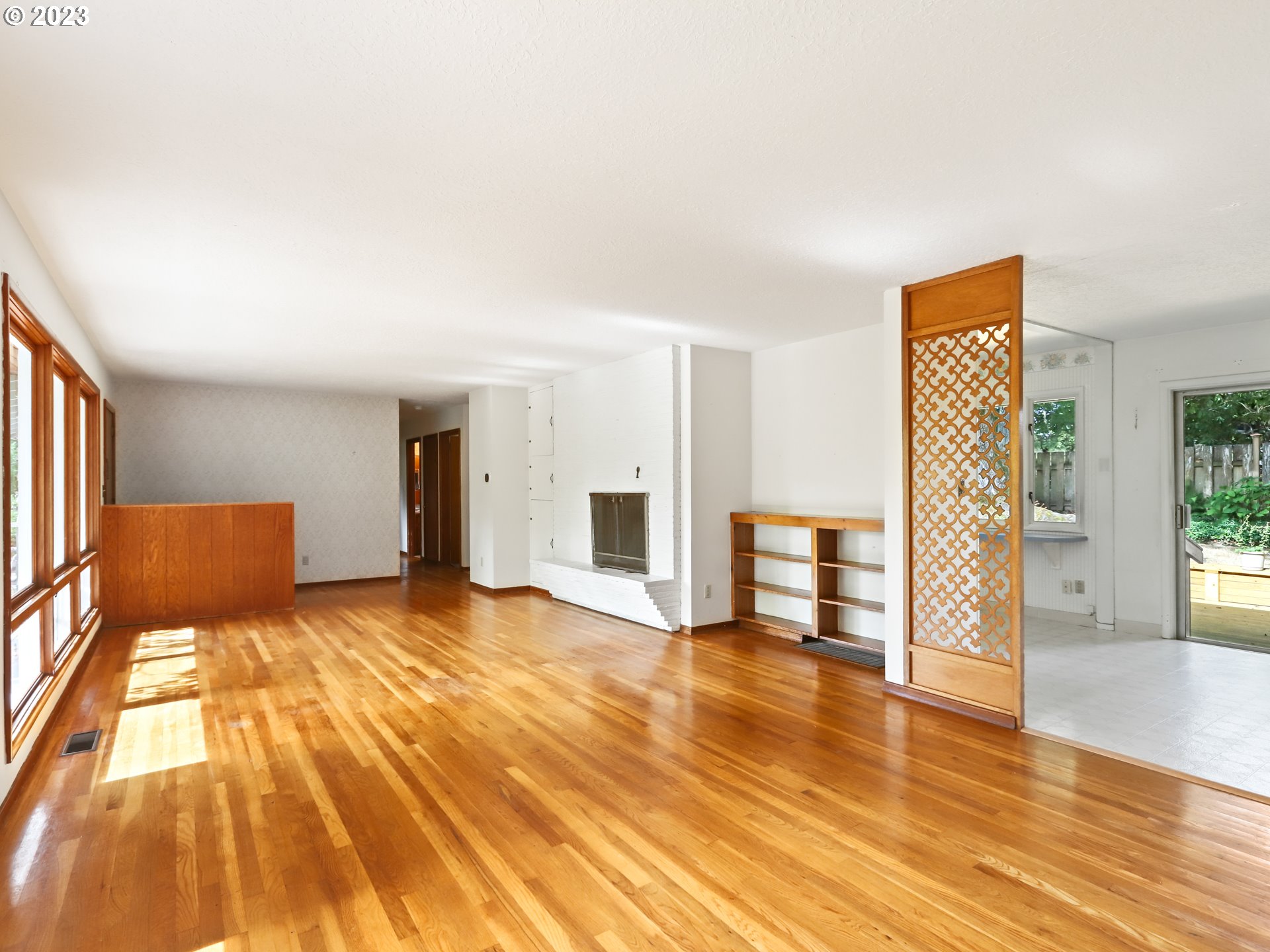 1975 Mapleleaf Road Lake Oswego, OR 97034 - Photo 11 of 37 a view of an empty room with wooden floor and a window