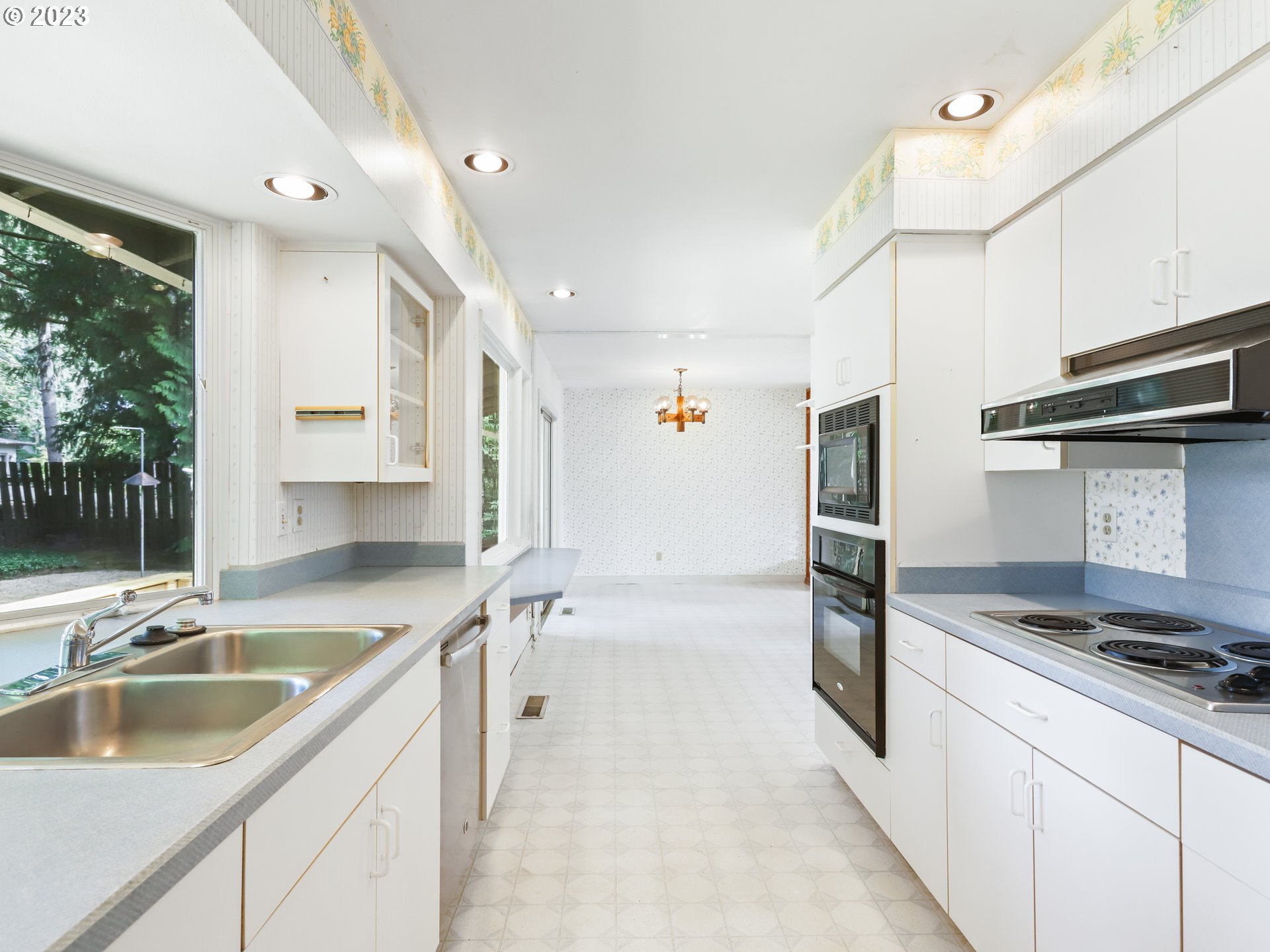 1975 Mapleleaf Road Lake Oswego, OR 97034 - Photo 14 of 37 a kitchen with a sink cabinets and window