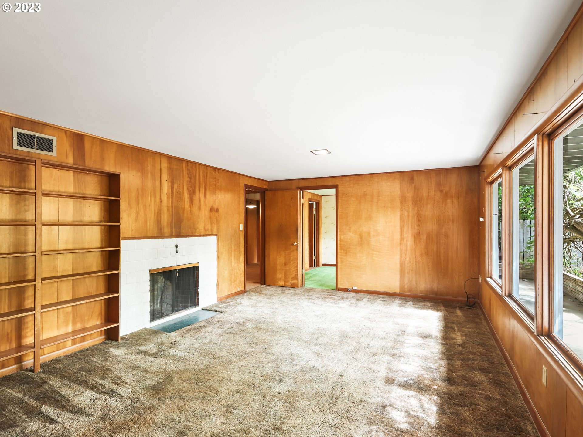 1975 Mapleleaf Road Lake Oswego, OR 97034 - Photo 23 of 37 a view of an empty room with a fireplace and a window