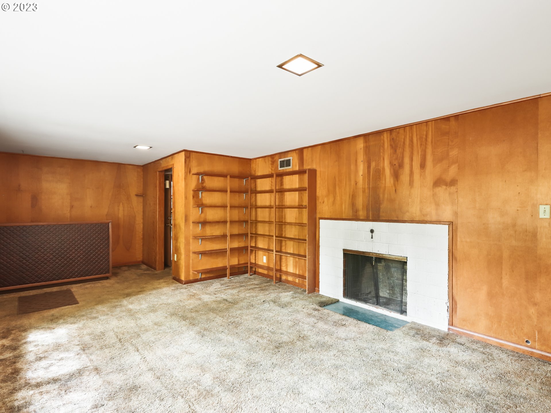 1975 Mapleleaf Road Lake Oswego, OR 97034 - Photo 24 of 37 a view of an empty room with a fireplace