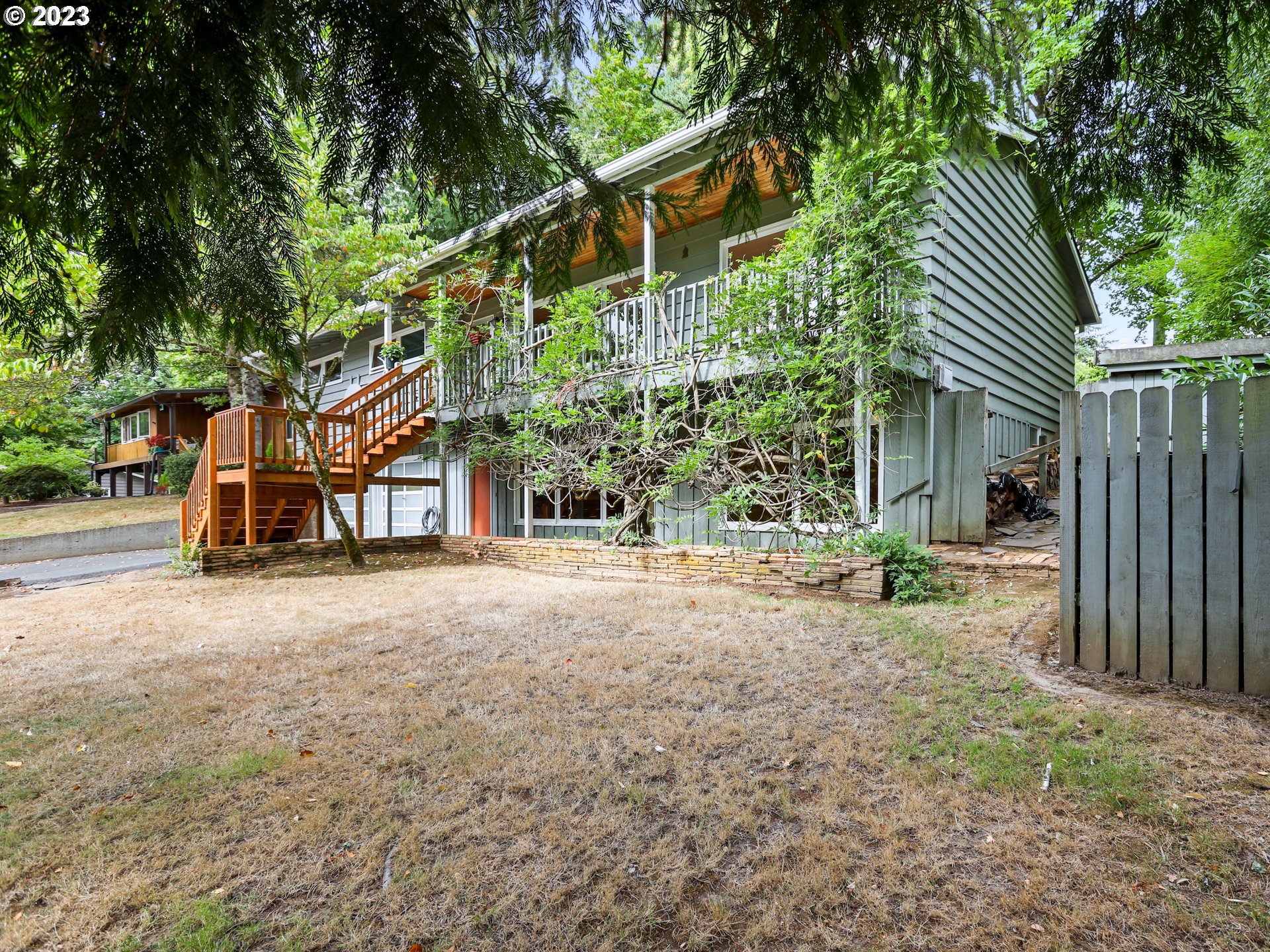 1975 Mapleleaf Road Lake Oswego, OR 97034 - Photo 3 of 37 a view of a house with a yard and tree s