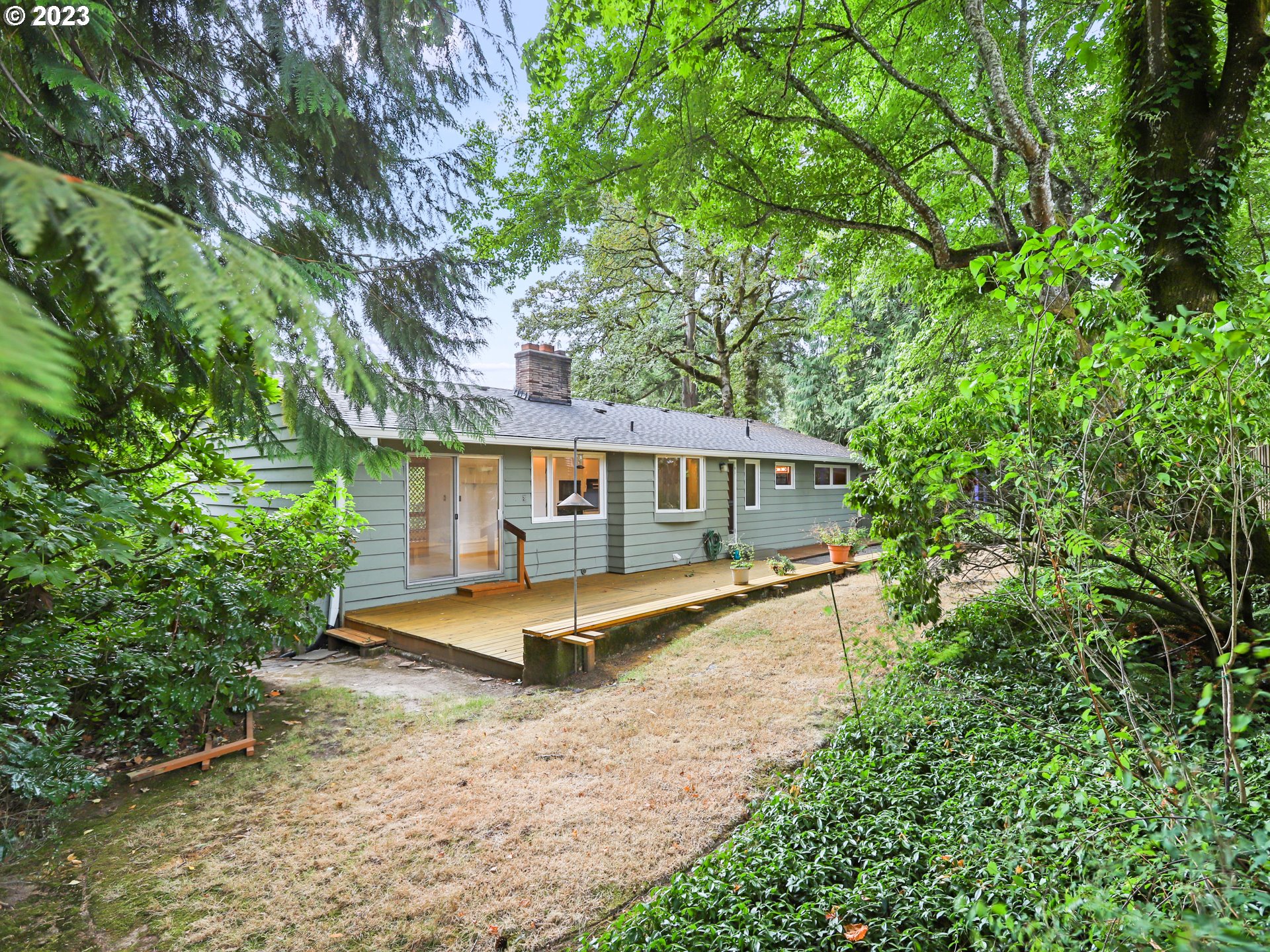 1975 Mapleleaf Road Lake Oswego, OR 97034 - Photo 33 of 37 a view of a house with large trees and a yard