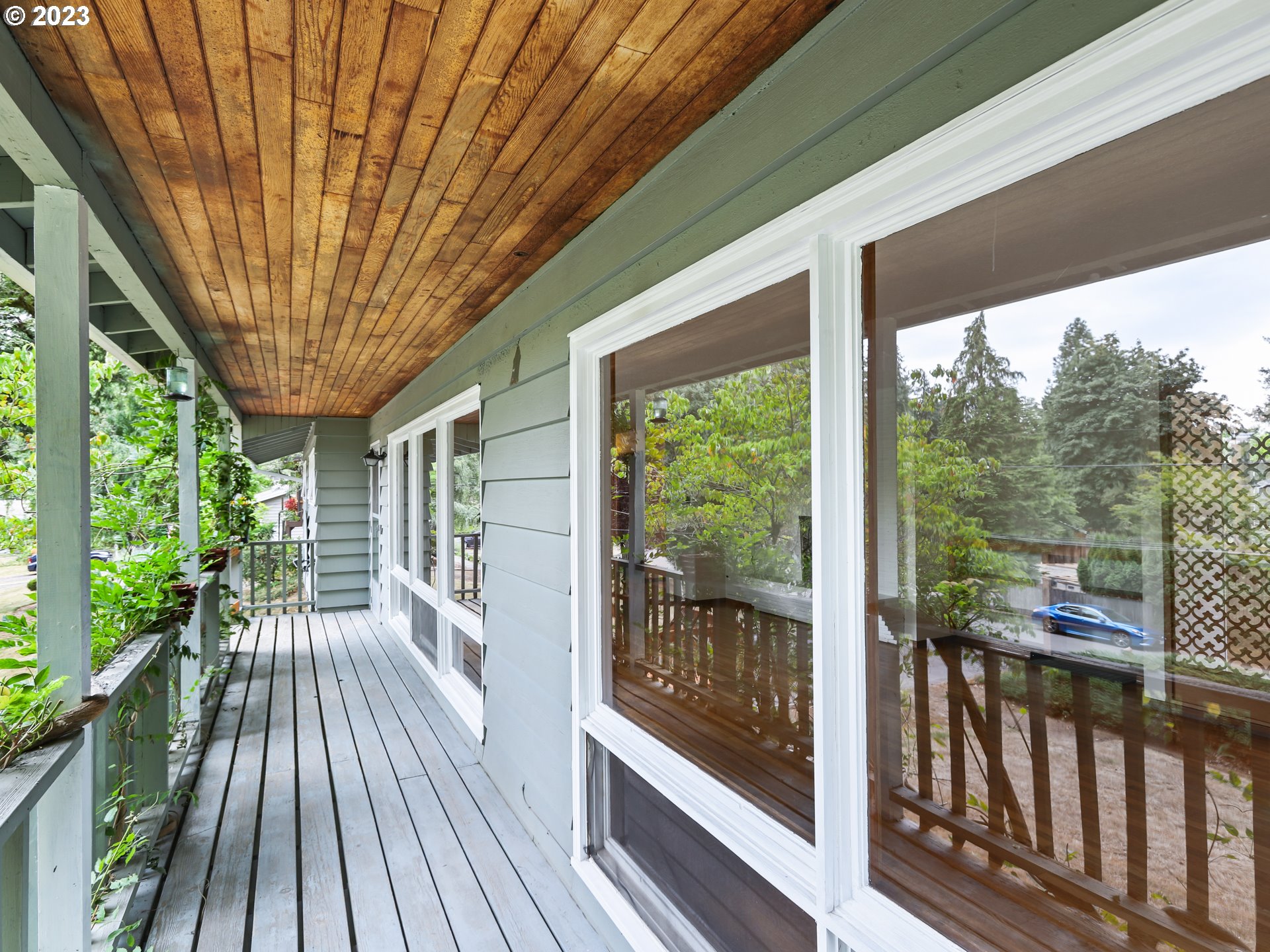 1975 Mapleleaf Road Lake Oswego, OR 97034 - Photo 6 of 37 a view of a room with wooden floor and iron stairs