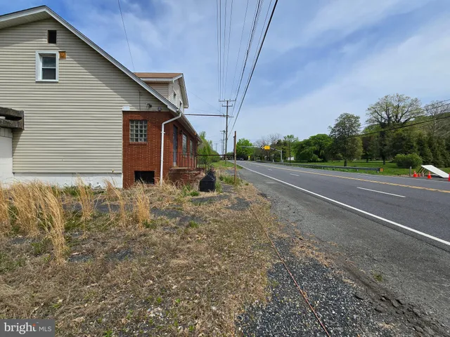 a view of a backyard of the house