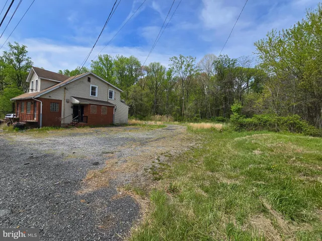 a view of a house with a big yard