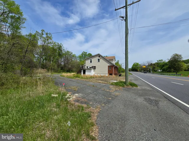 a view of a road with a yard