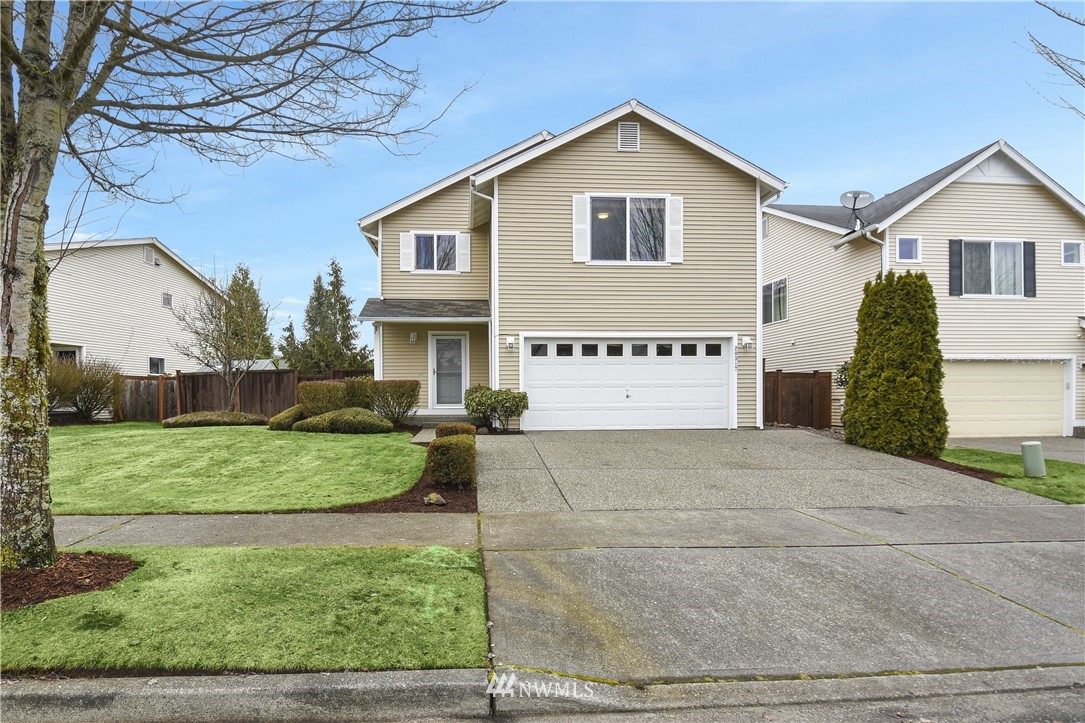 20317 Corbridge Road Southeast Monroe, WA 98272 - Photo 1 of 33 a view of a house with a yard and garage
