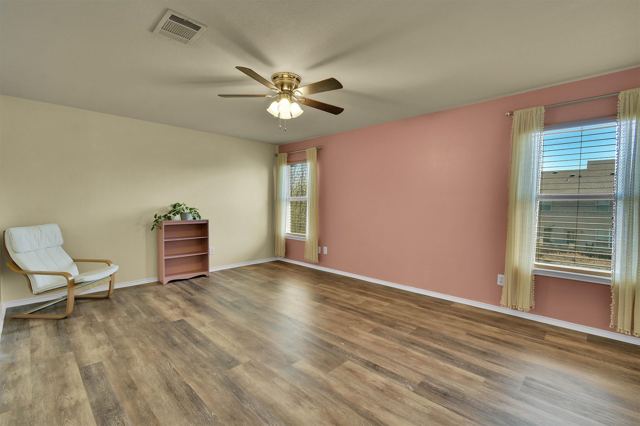 92 Verde Ranch Loop Leander, TX 78641 - Photo 22 of 37 Unfurnished room with wood finished floors and ceiling fan
