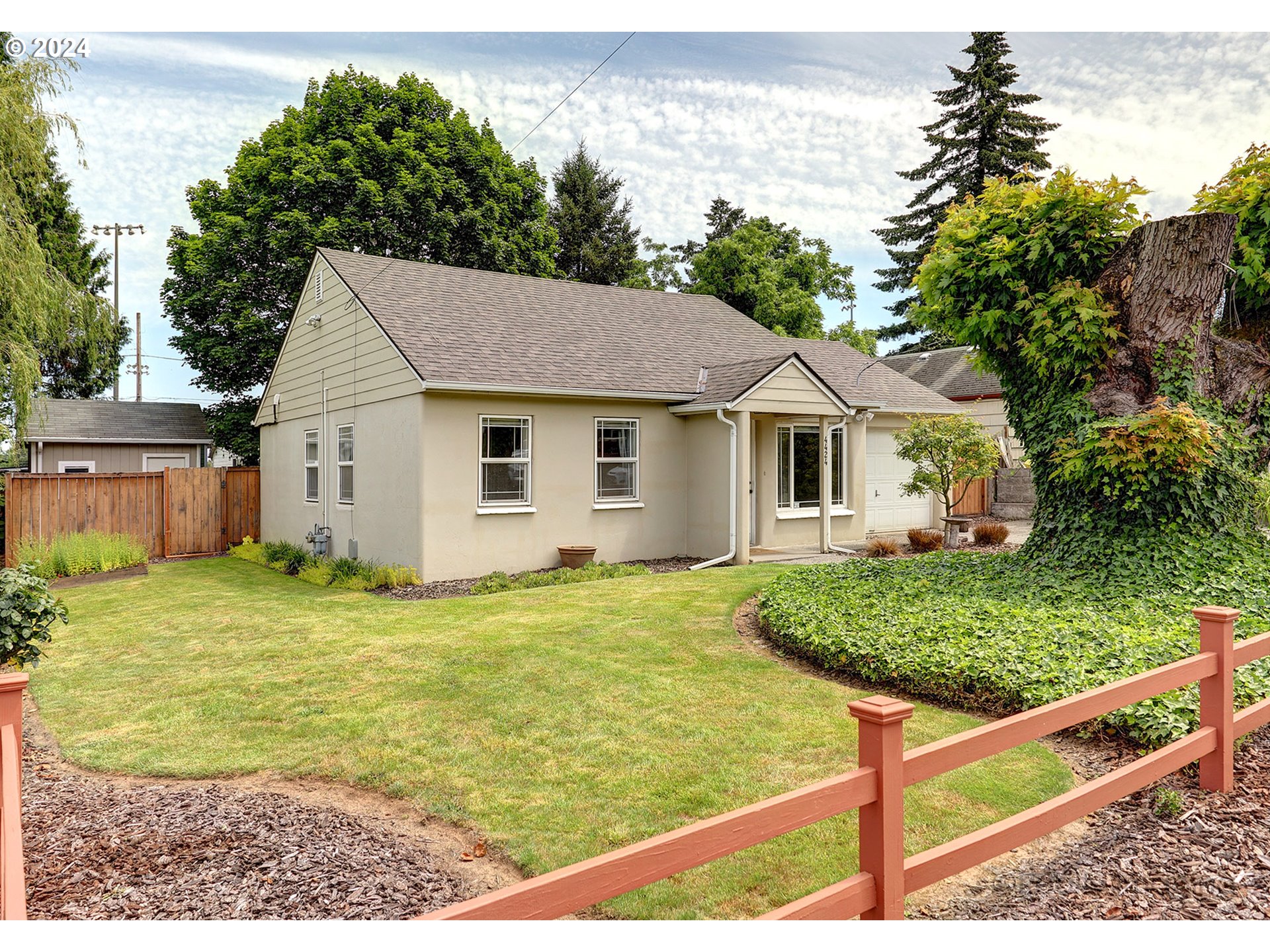 4424 Northeast 115th Avenue Portland, OR 97220 - Photo 3 of 24 a house view with a backyard space