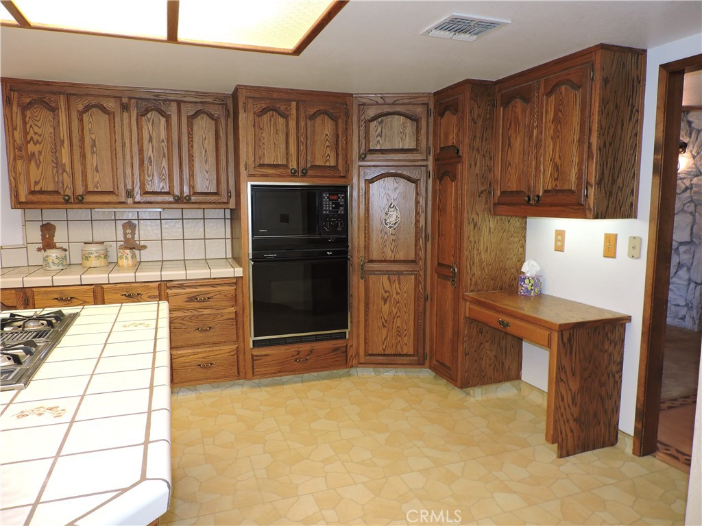 26931 Columbia Way Tehachapi, CA 93561 - Photo 34 of 49 Built-in Microwave and oven. Tons of cabinet space!