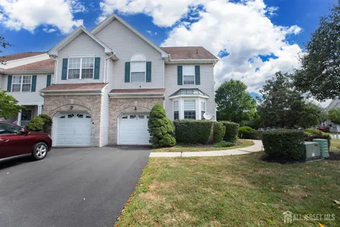 a view of house and yard with green space