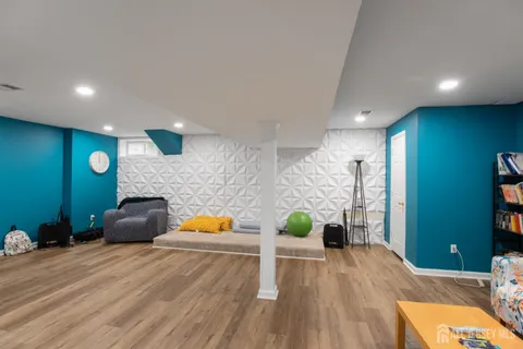 a workspace with furniture and wooden floor