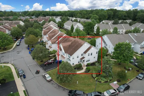 an aerial view of a house with outdoor space