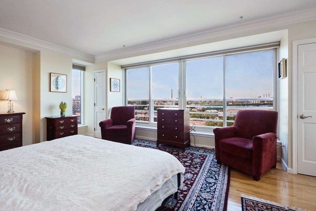197 8th Street, Unit PH230 Boston, MA 02129 - Photo 17 of 29 a bedroom with a bed window and a couch