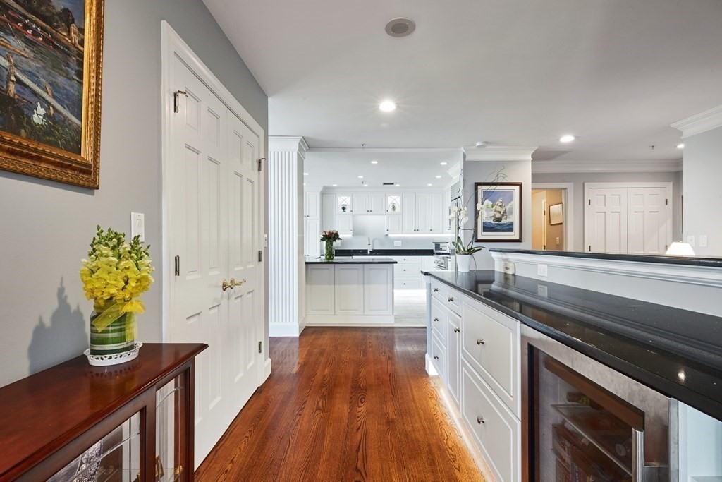 197 8th Street, Unit PH230 Boston, MA 02129 - Photo 8 of 29 a large kitchen with stainless steel appliances granite countertop a lot of counter space and wooden floor