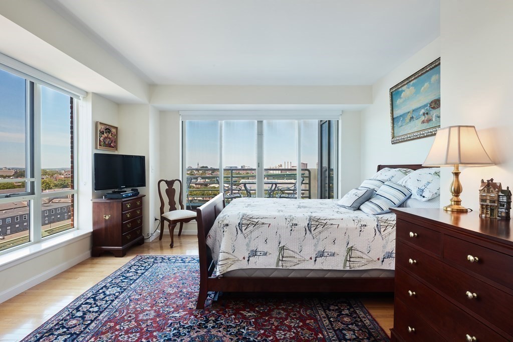 197 8th Street, Unit PH230 Boston, MA 02129 - Photo 10 of 29 a bed room with a bed and a television