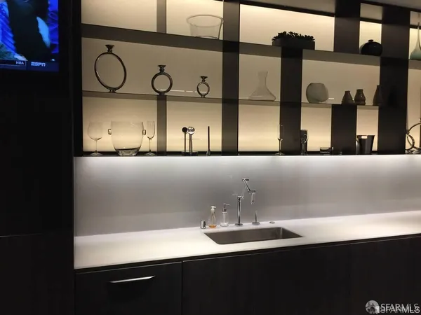 a view of a bathroom with a large tub and mirror