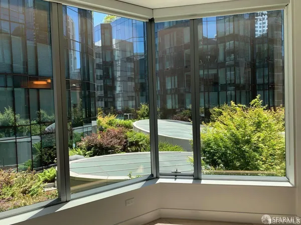 a view of a glass door and a window