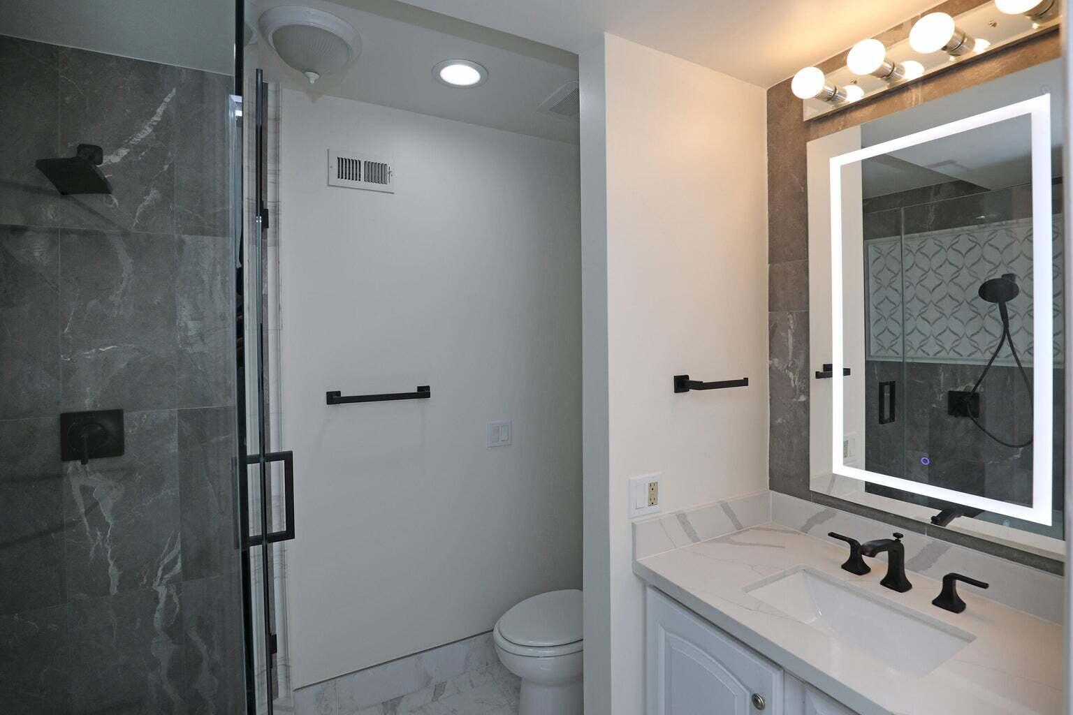 4715 Aragon Drive Carpinteria, CA 93013 - Photo 18 of 29 a bathroom with a sink a toilet and shower
