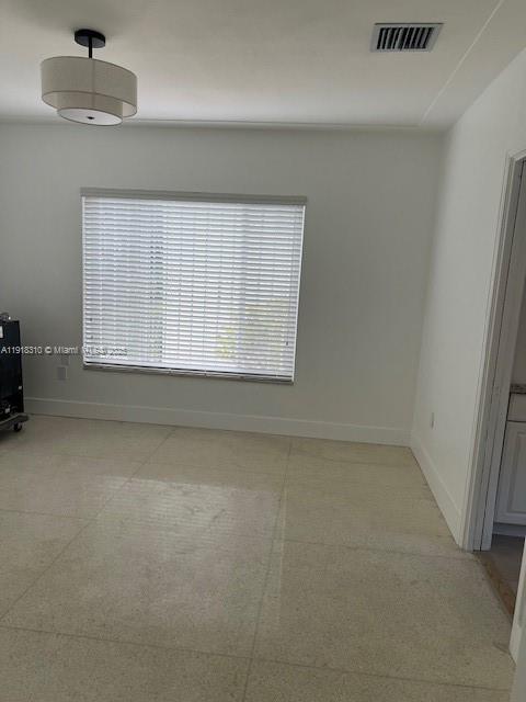 1860 Southwest 4th Avenue Miami, FL 33129 - Photo 12 of 13 an empty room with a empty space and windows