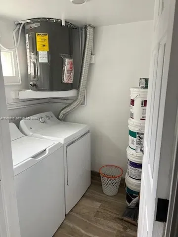 a bathroom with a toilet and a mirror