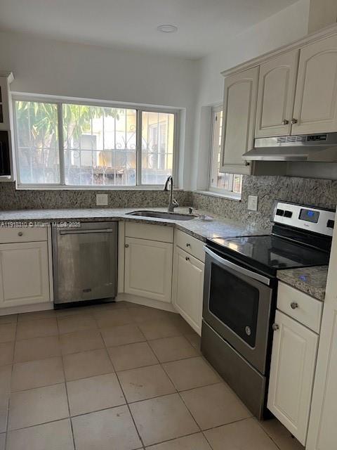 1860 Southwest 4th Avenue Miami, FL 33129 - Photo 3 of 13 a kitchen with a stove sink and cabinets