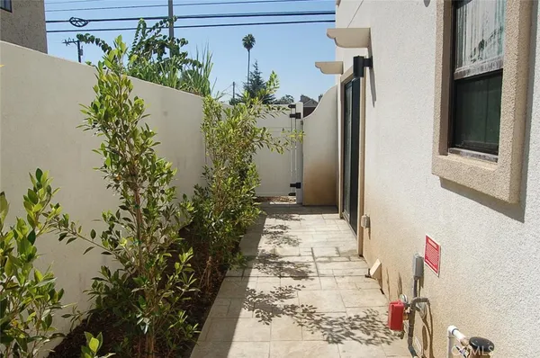 a view of path along with house and trees