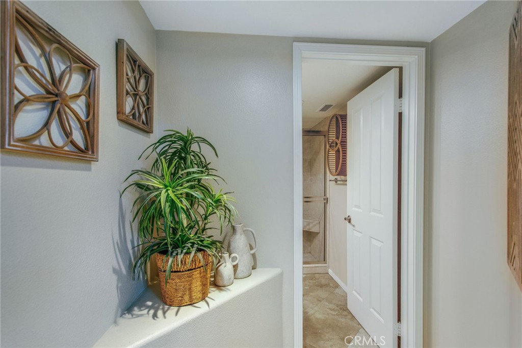 36 Cameray Heights Laguna Niguel, CA 92677 - Photo 11 of 27 a potted plant sitting in front of a bathroom
